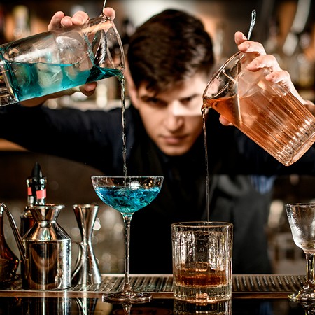 Bartender mixing drinks